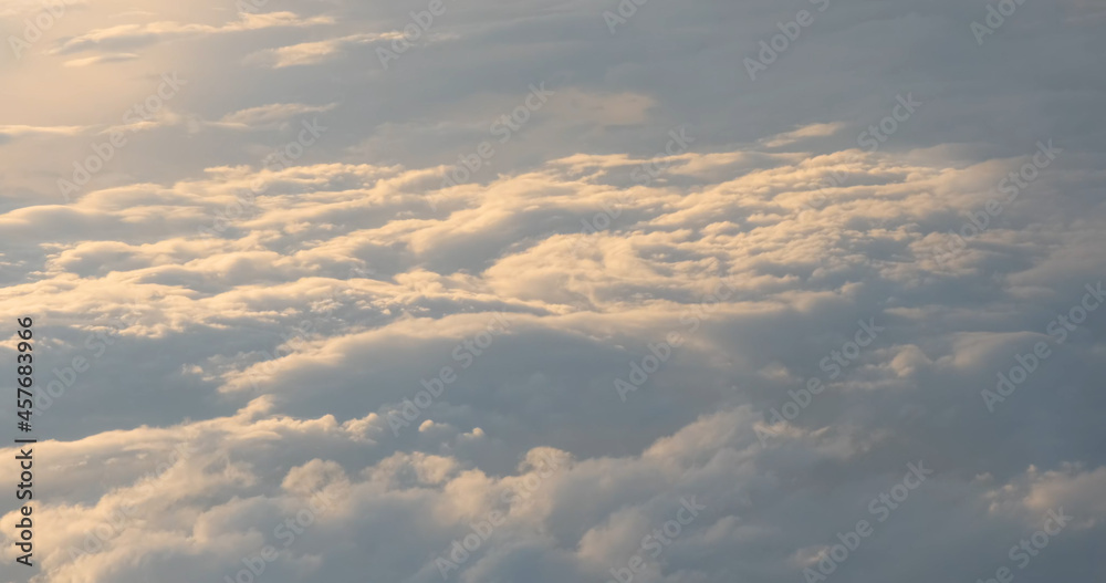 Soft white clouds aerial foto. Peaceful heaven illuminated by sun. Flying above spreading clouds. Beautiful sky view from flying airplane. Relaxation weather cloudscape backgrounds. Abstract foto