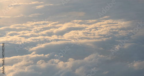 Soft white clouds aerial foto. Peaceful heaven illuminated by sun. Flying above spreading clouds. Beautiful sky view from flying airplane. Relaxation weather cloudscape backgrounds. Abstract foto