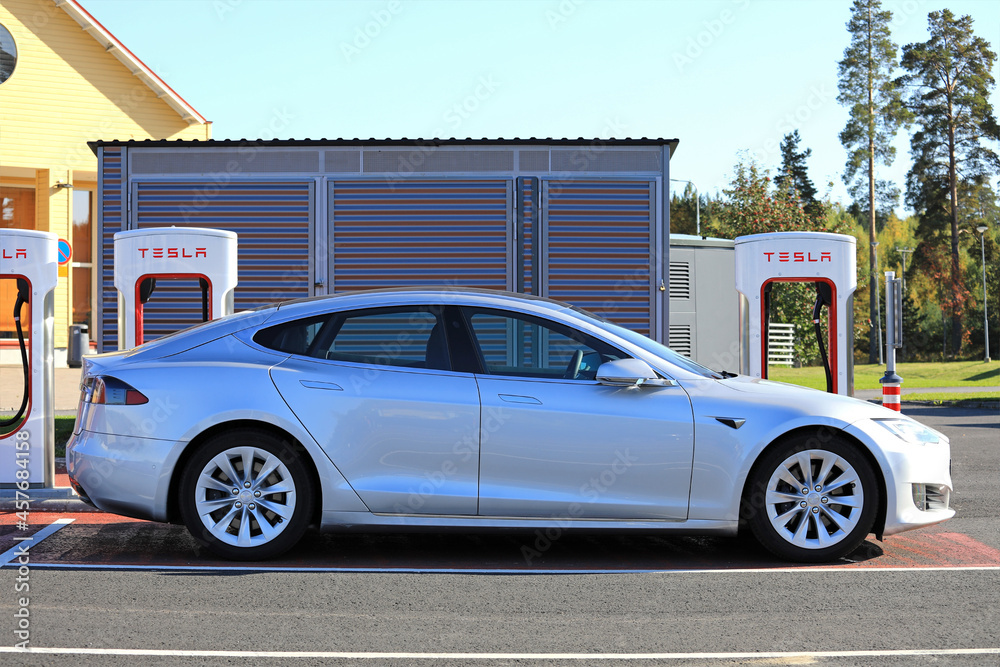 Silver Tesla Model S at Supercharger Charging Station Stock Photo ...