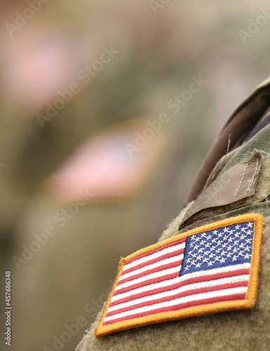 US soldiers. US army. USA patch flag on the US military uniform. Veterans Day. Memorial Day.