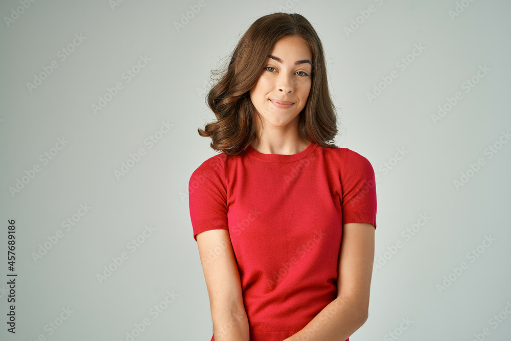 beautiful woman in a red t-shirt hair care isolated background beautiful woman in a red t-shirt hair care isolated background