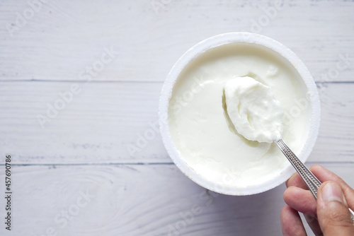 fresh yogurt in a bowl on table 