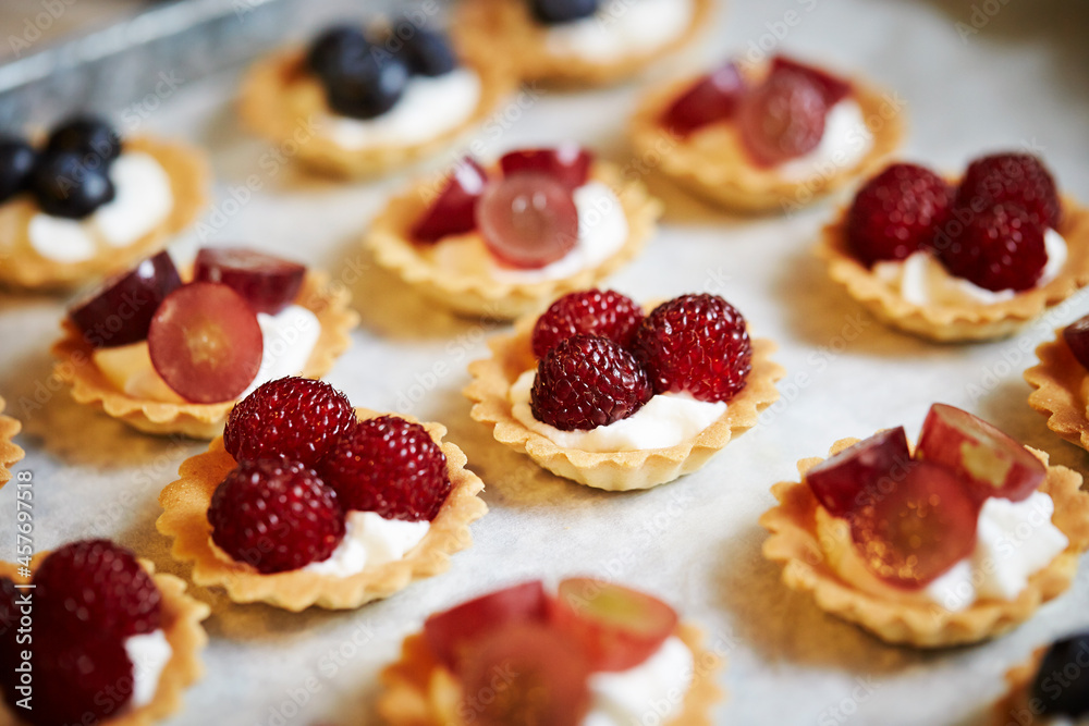 Fruit tarts with raspberries on a plate Fruit tarts with raspberries on a plate