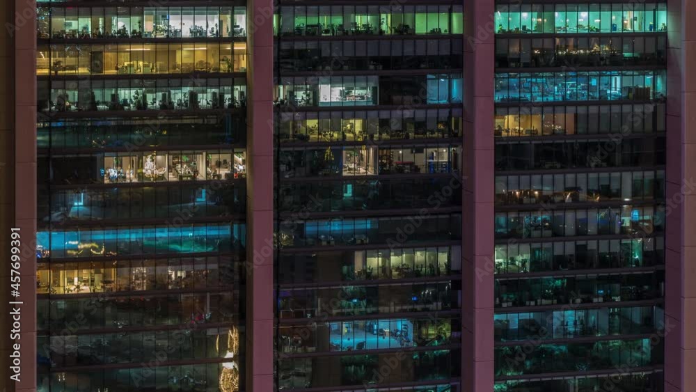 Big glowing windows in modern office buildings timelapse at night Big glowing windows in modern office buildings timelapse at night