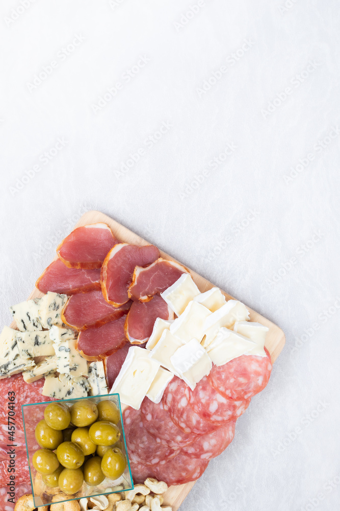 Charcuterie board salami olives cheese blue nuts and taralini Charcuterie board salami olives cheese blue nuts and taralini
