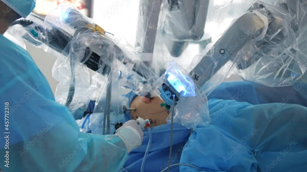 Surgical robot perform operation in clinic. Doctor doing surgery with modern robotic equipment. Futuristic operation with minimally invasive involvement.