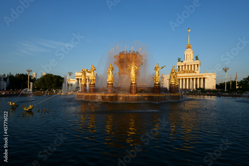 Fountain of friendship of the people evening view at VDNH exhibition with clear blue sky and clouds in Moscow, tourism in Russia capital. Architecture of Soviet Union era, travel to Russia capital.