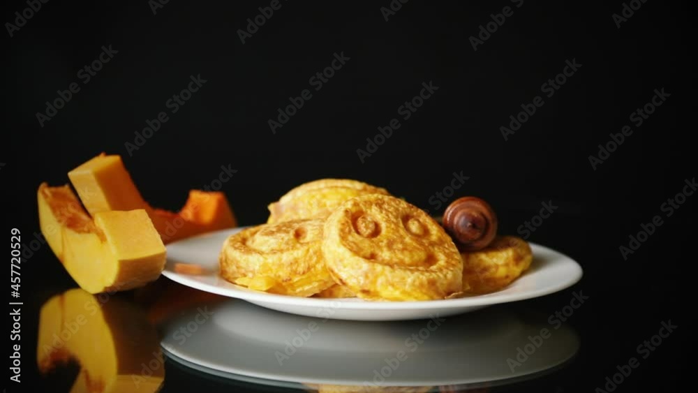 sweet lush pumpkin pancakes with honey in a plate sweet lush pumpkin pancakes with honey in a plate