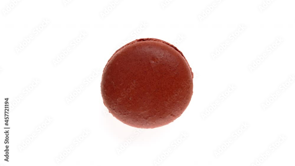Top view of chocolate macaroon cookie rotating. Isolated on white background. Top view of chocolate macaroon cookie rotating. Isolated on white background.