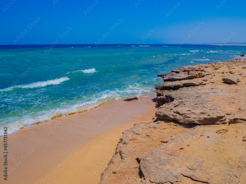 Beautiful wild beach with turquoise water, orange sand and coral reef. Egypt, Marsa alam. Red sea Beautiful wild beach with turquoise water, orange sand and coral reef. Egypt, Marsa alam. Red sea