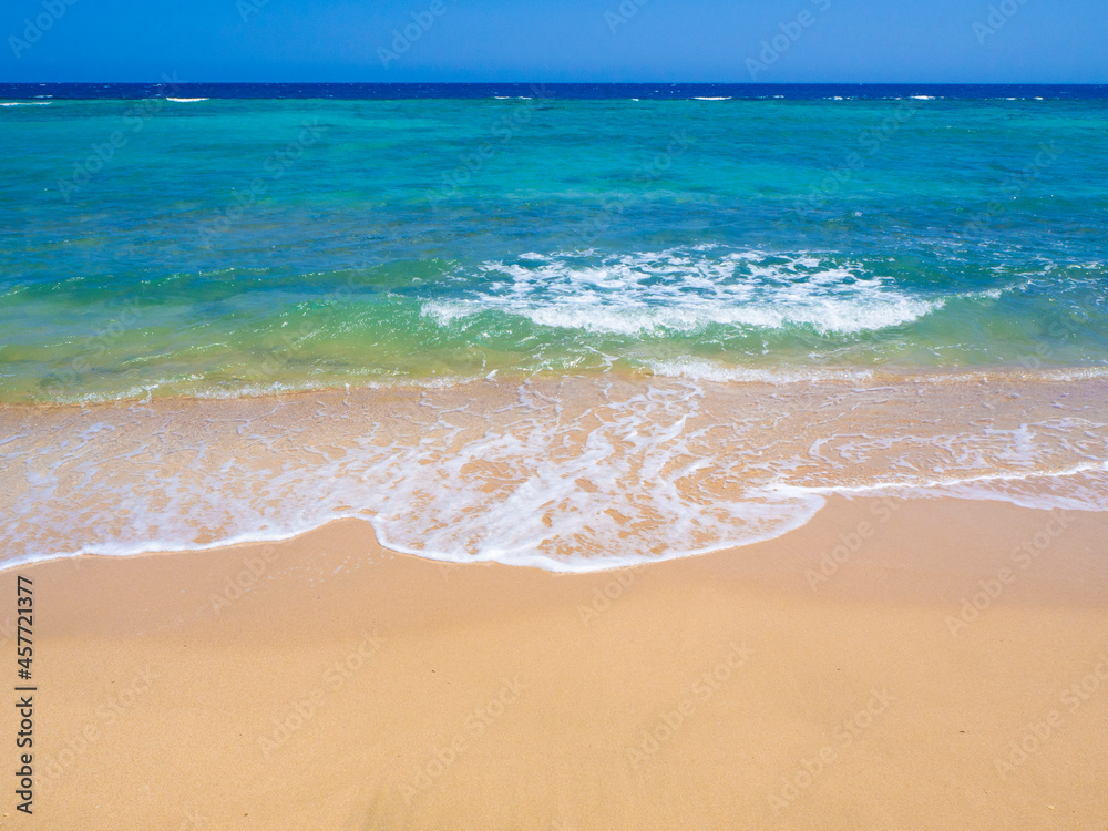 Obraz premium Beautiful wild beach with turquoise water, orange sand and coral reef. Egypt, Marsa alam. Red sea