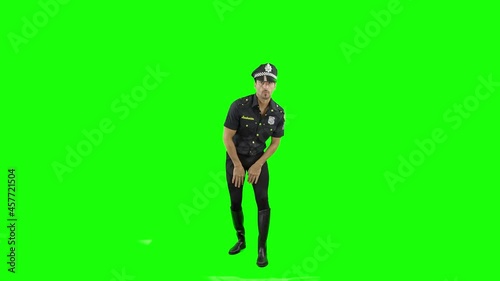 Hombre policia bailando en chroma key pantalla verde  photo