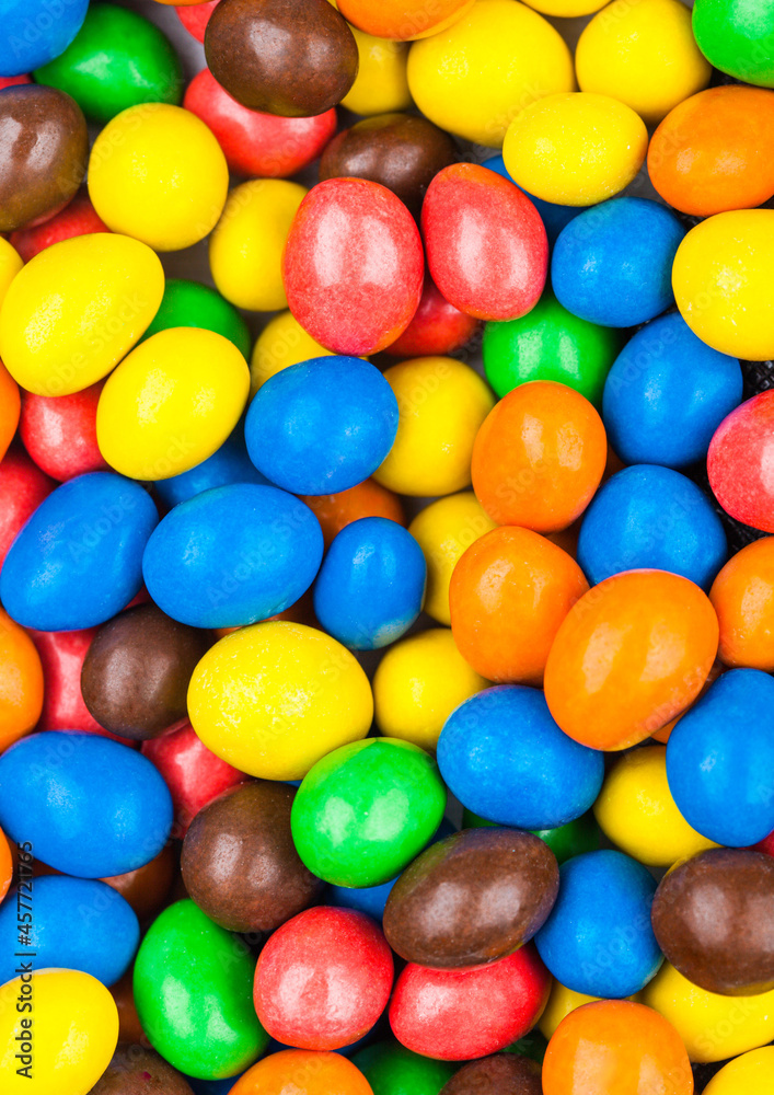 Milk chocolate sweet candies with a rice centre in a sugar shell to use as background. Milk chocolate sweet candies with a rice centre in a sugar shell to use as background.