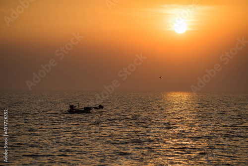 fisherman sail boat on sea at sunset, Bang Pu