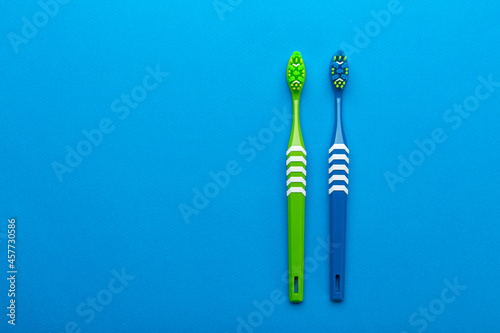 Toothbrushes on a blue background. Concept toothbrush selection. Oral cavity care.