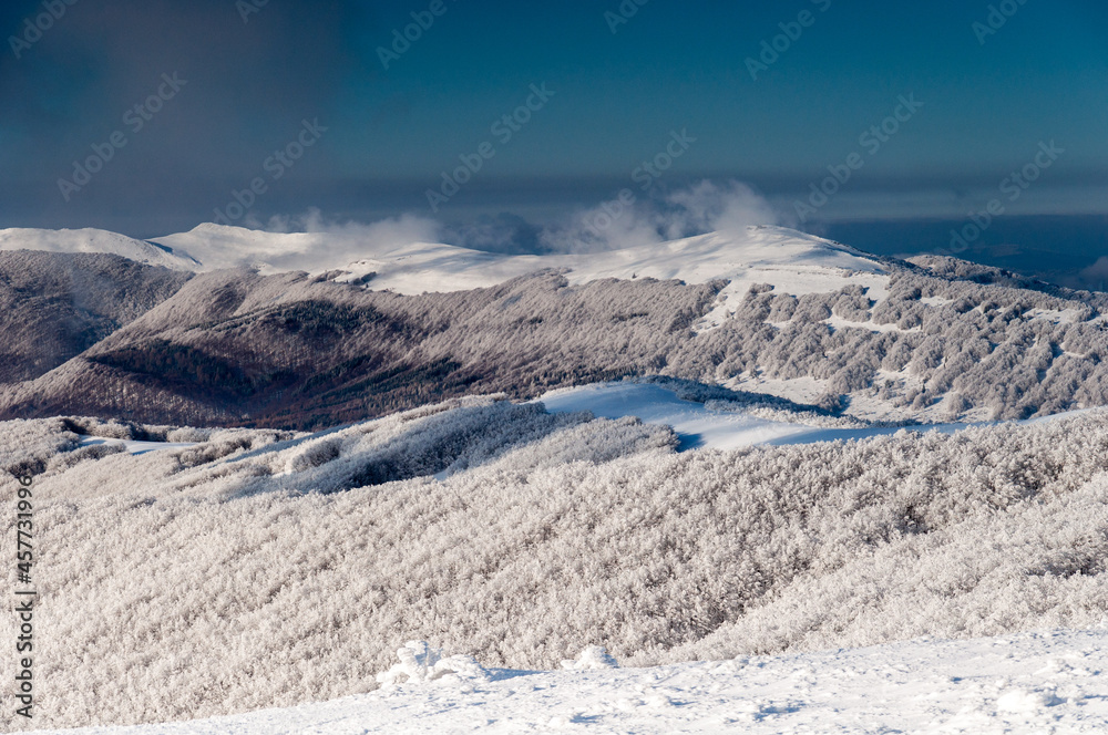 Obraz premium A view from the top of Wielka Rawka to the peaks of the Bieszczady Mountains, the Bieszczady Mountains