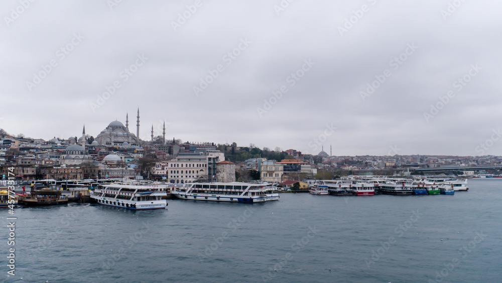 Suleymaniye Mosque, Ferry terminal cloudy weather dark clouds winters in Istanbul, Ottoman imperial mosque