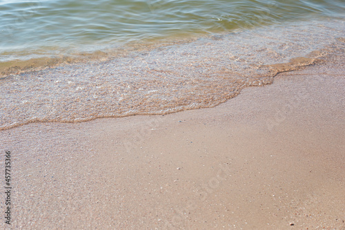 Soft wave of the sea on a sandy beach