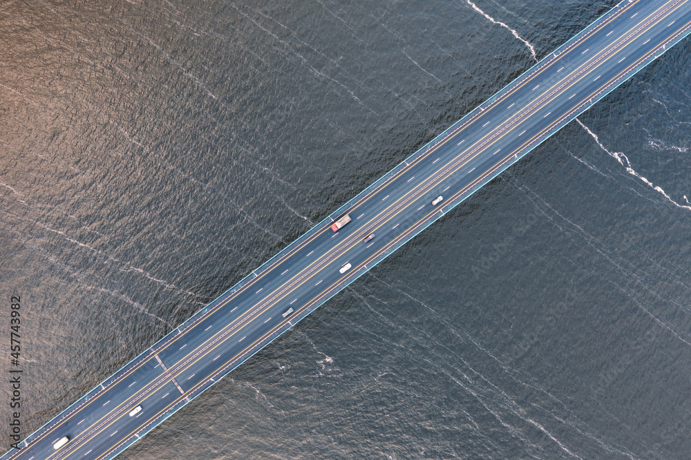 Highway over rippled water surface top view