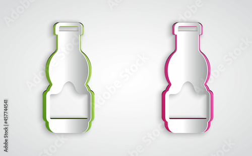 Paper cut Sauce bottle icon isolated on grey background. Ketchup, mustard and mayonnaise bottles with sauce for fast food. Paper art style. Vector