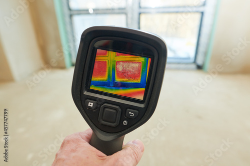 thermal imaging camera inspection of window building. check heat loss