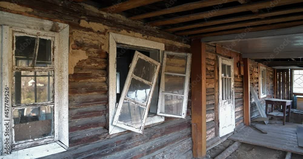 Old wooden abandoned house with broken windows. Cinema 4K 60fps video Old wooden abandoned house with broken windows. Cinema 4K 60fps video