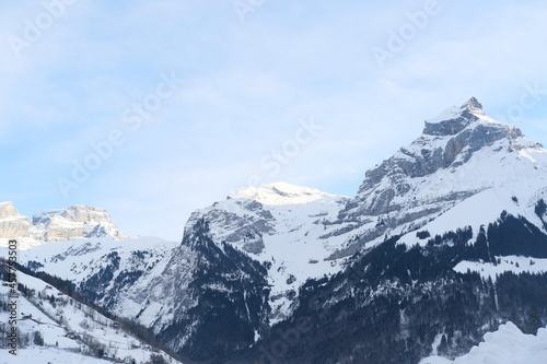 beautiful winter landscape, snow-covered trees, mountainpass, snowfall in the mountains, Swiss Alps in the snow, walks in the winter white forest, tourism, winter sports © kittyfly