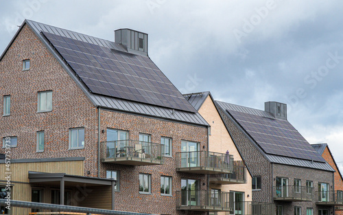 Modern house with solar panels on the gable roof © bzzup