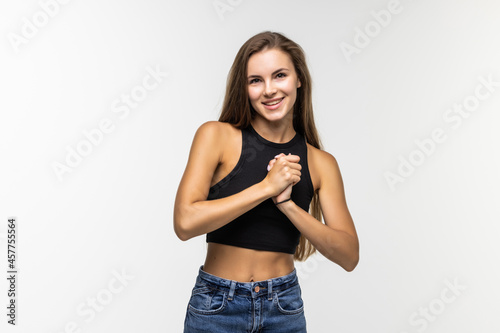 Happy attractive woman standing over gray background