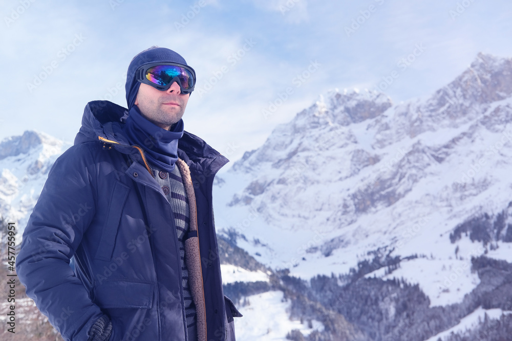 young man wearing sunglasses, mountain hiker admiring mountain winter landscape, Sports Concept, Healthy Lifestyle, Winter Activity, beautiful winter natural landscape, walks in winter white forest young man wearing sunglasses, mountain hiker admiring mountain winter landscape, Sports Concept, Healthy Lifestyle, Winter Activity, beautiful winter natural landscape, walks in winter white forest