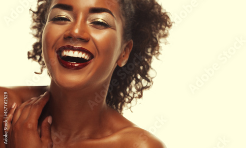 lifestyle and people concept: Portrait of a beautiful young African woman smiling.