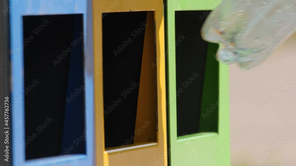 Hand man put bottle plastic trash can. Reduce waste recycle bins. Garbage recycling plastic trash bins. Close up hand throwing plastic bottle recycling container garbage sorting rubbish collection bin