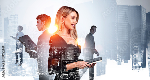Photography Smiling businesswoman wearing black dress is holding notebook