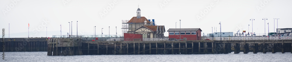 Abandoned old Victorian wooden pier building at Dunoon