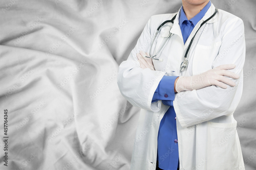 Doctor standing on silk background Doctor standing on silk background