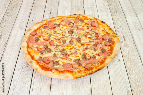 great pizza with bologna mortadella with roasted minced meat, sliced salami and lots of mozzarella cheese