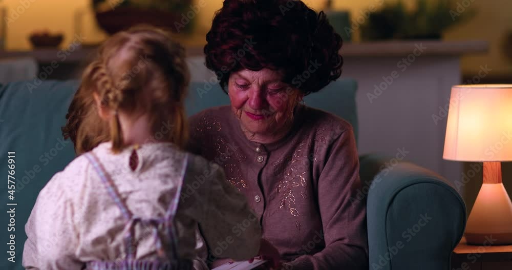 a kind grandmother spends time with her grandchildren on a warm cozy evening at home a kind grandmother spends time with her grandchildren on a warm cozy evening at home