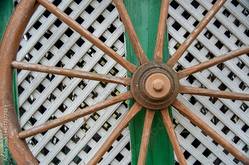 old wooden wheel in the garden