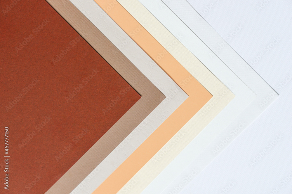 abstract background concept with pattern of earth tones colour paper, layers of blank brown paper and white, cream colour, beige colour background. abstract background concept with pattern of earth tones colour paper, layers of blank brown paper and white, cream colour, beige colour background.