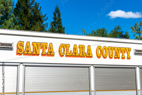 Santa Clara County sign on the side of a paramedic vehicle. Blue sky, green trees. - San Jose, California, USA - 2021