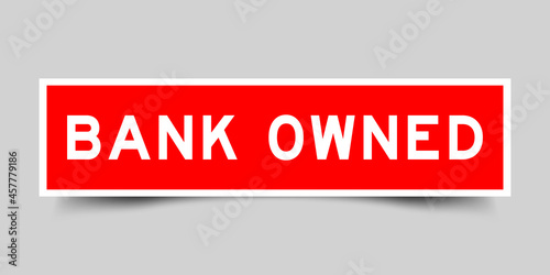 Square label sticker with word bank owned in red color on gray background
