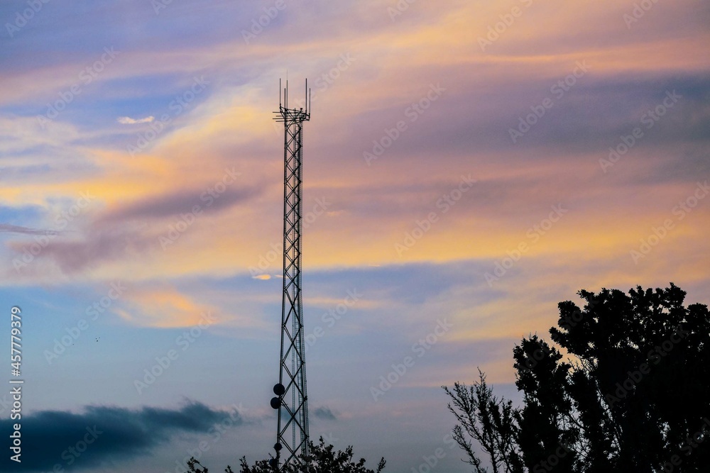 phone tower silhouette in the sunset