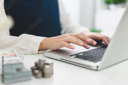 Business Professional Accountant Woman working on laptop computer making research for planning startup at desktop working process in office
