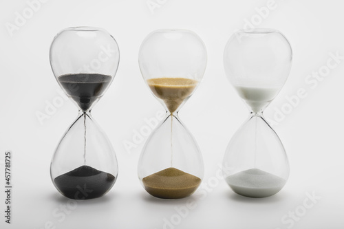 Various sand clock , Various hourglass as time passing on white background , Life time concept