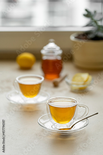 tea drinking in transparent glass dishes