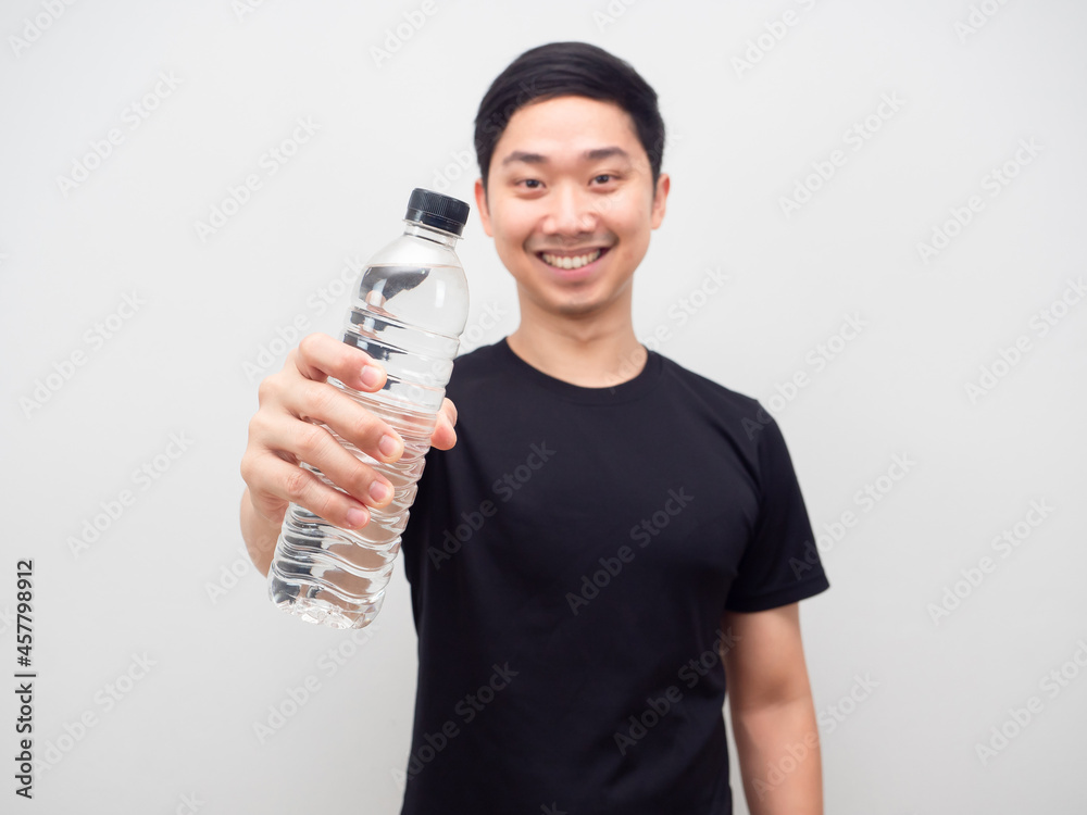 Asian man show water bottle happy smile white background Asian man show water bottle happy smile white background