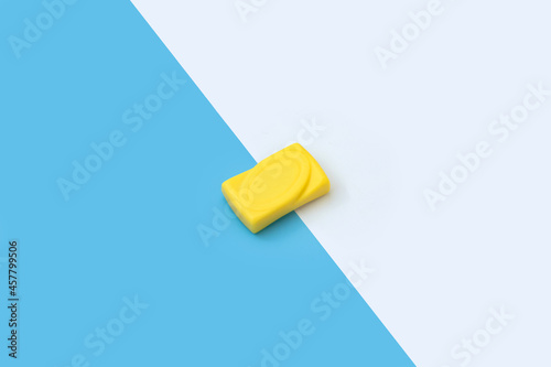 Yellow soap isolation on diagonal blue and white background