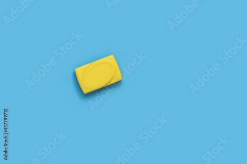 Yellow soap isolation on blue background