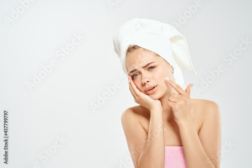 pretty woman with a towel on my head acne on the face Studio close-up
