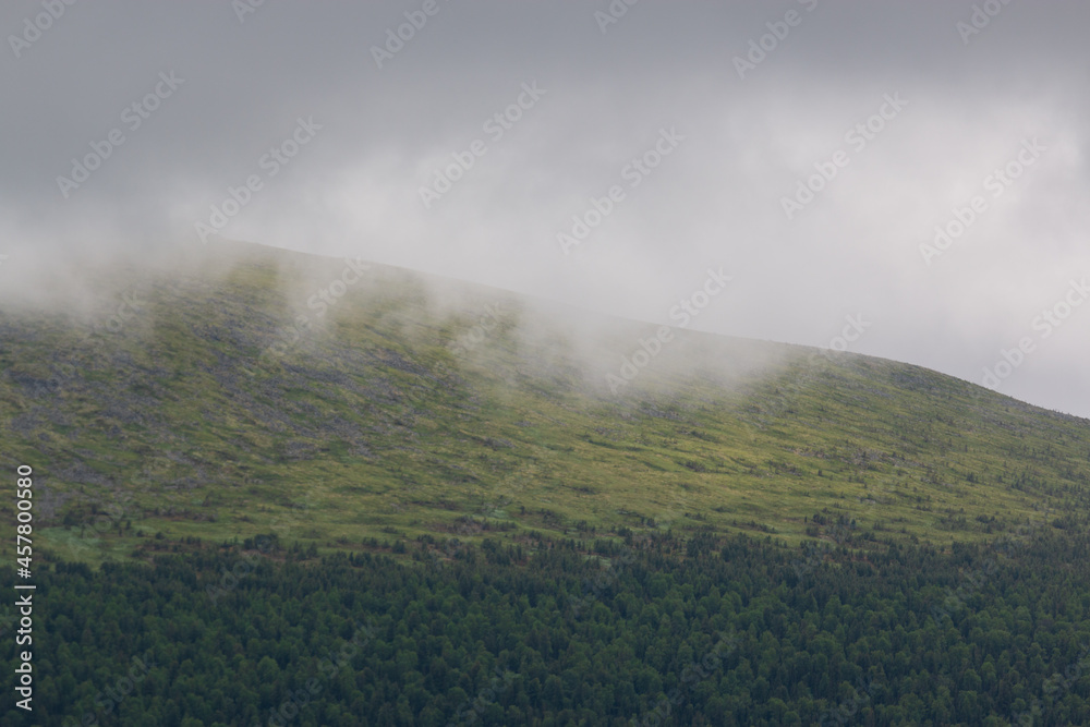 cloud descending on mountain ural